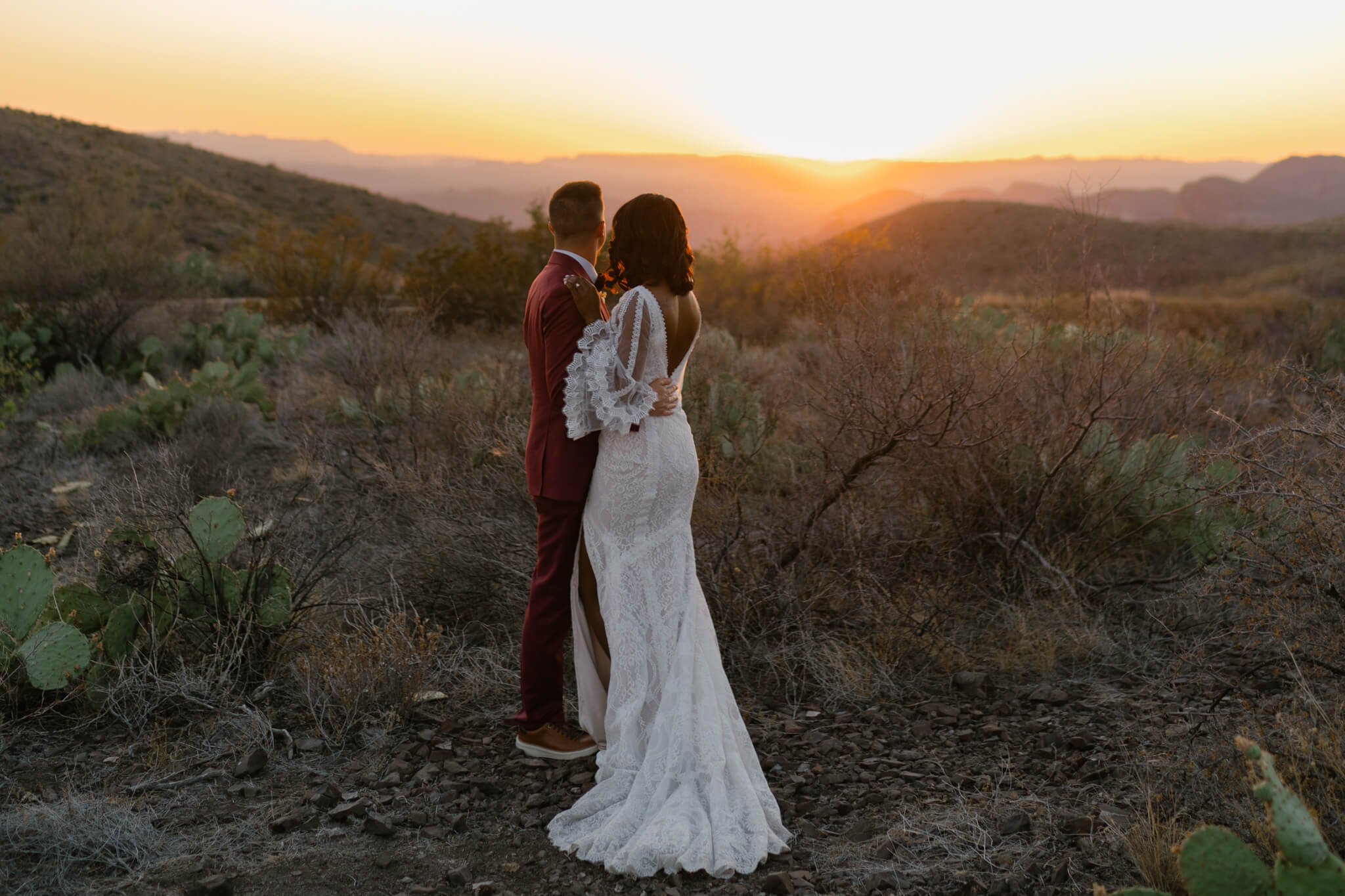 couple looking over the rolling mountains in west texas in Big Bend, one of the best places to elope in Texas