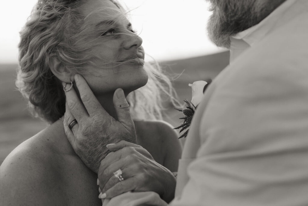 close up detail of a couple holding hands