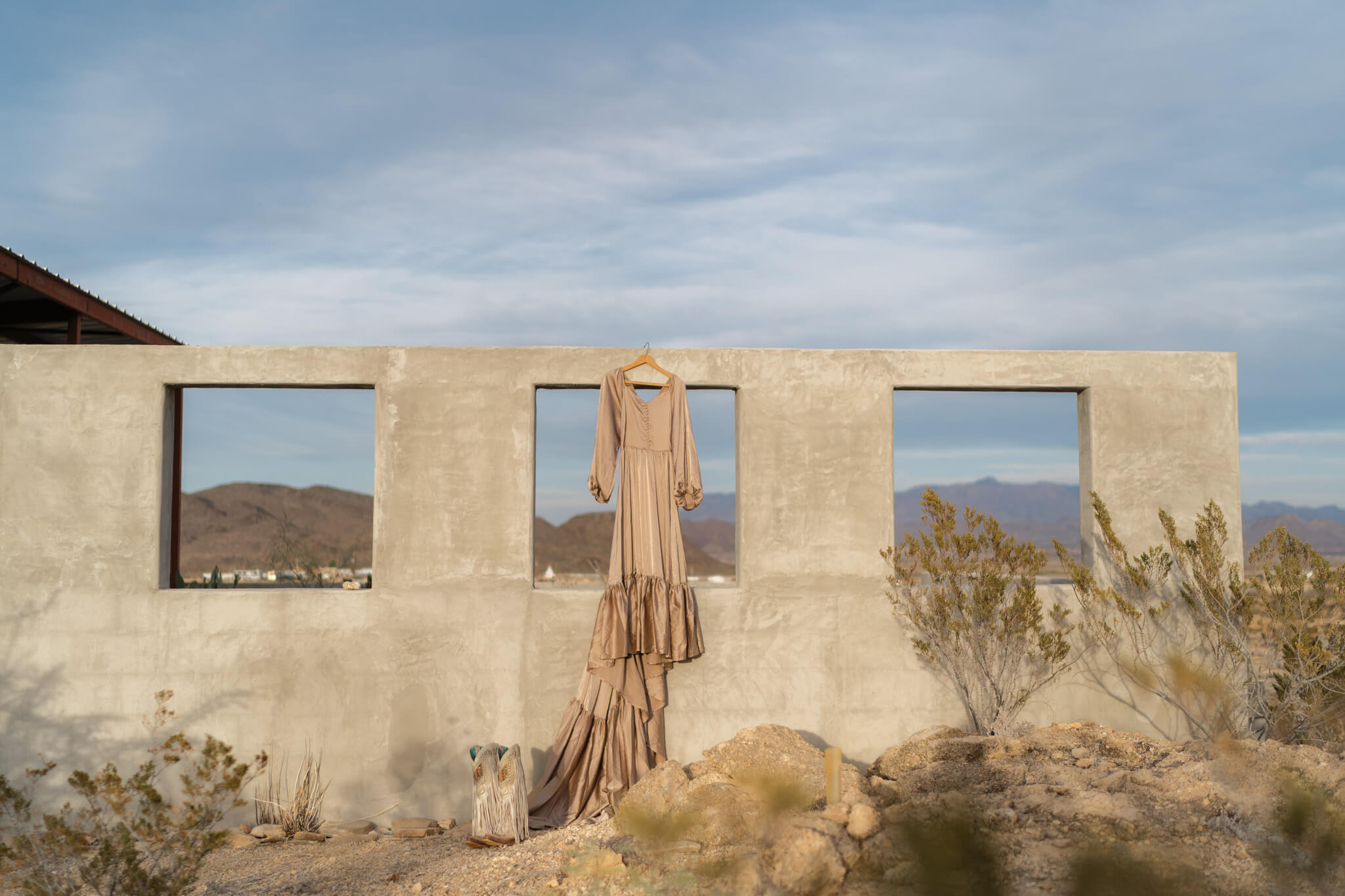 details of a dress hanging at a venue