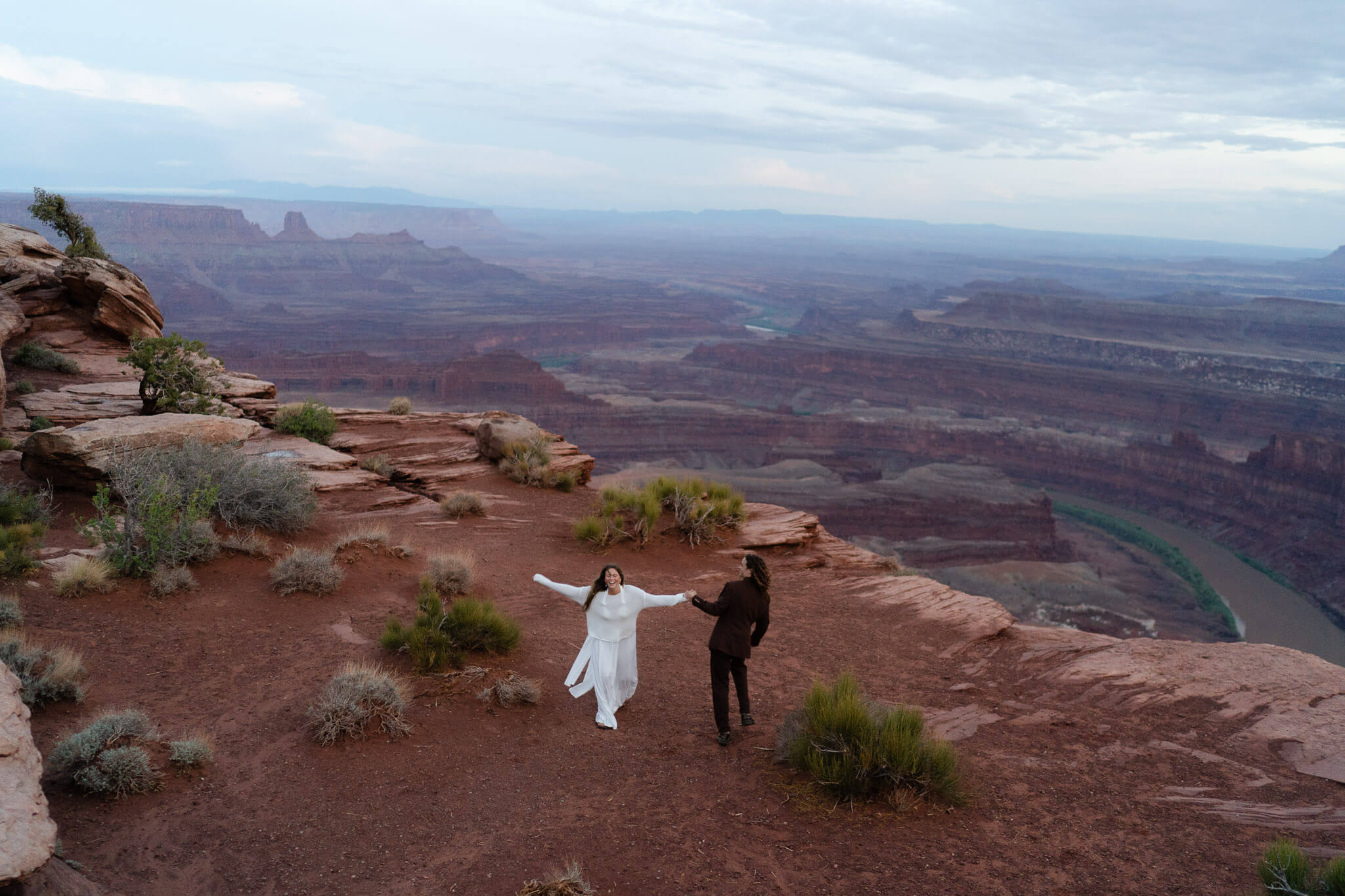 Couple joyfully celebrating their Canyonlands Elopement
