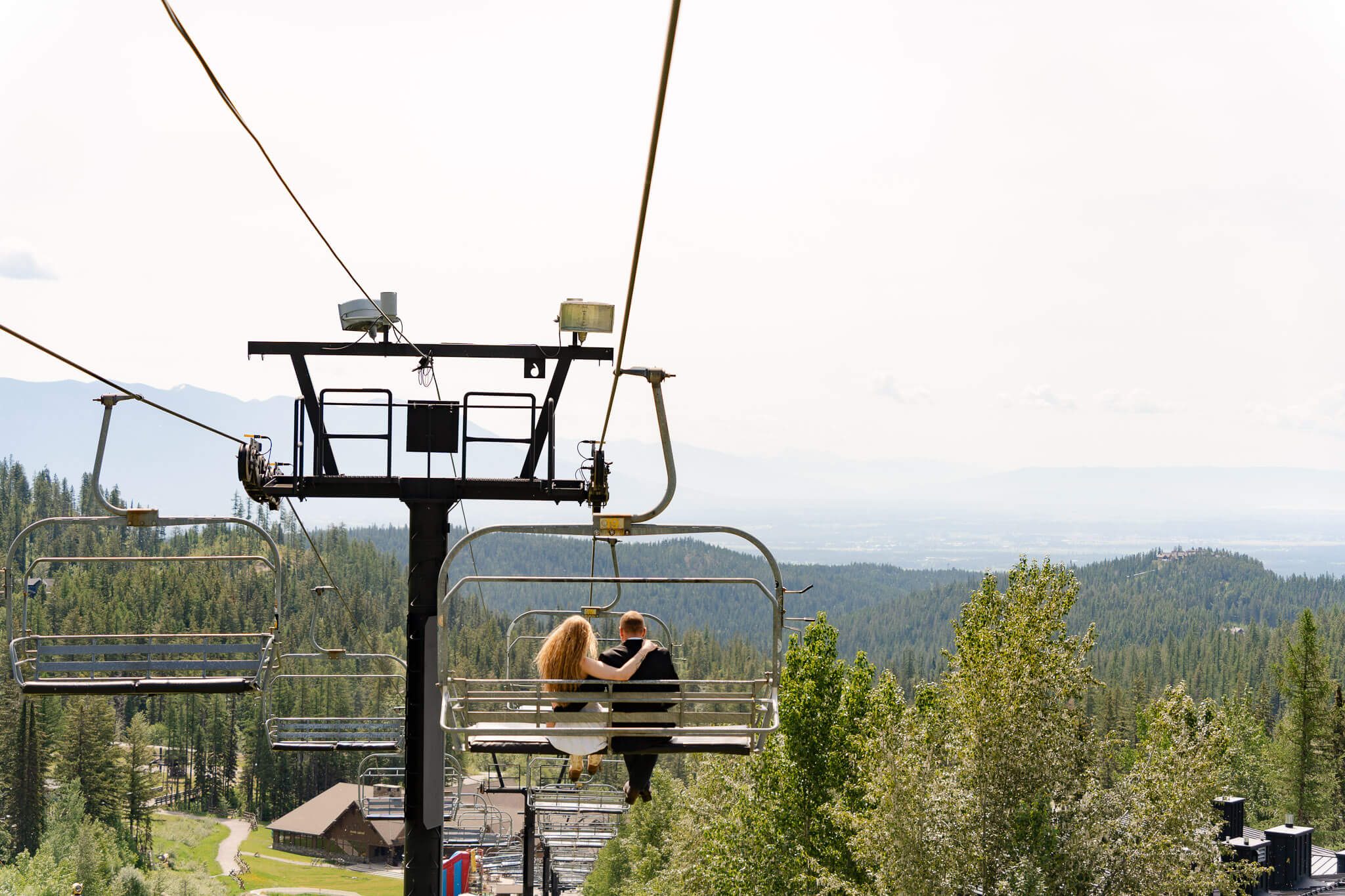 Couple riding a ski lift in Montana