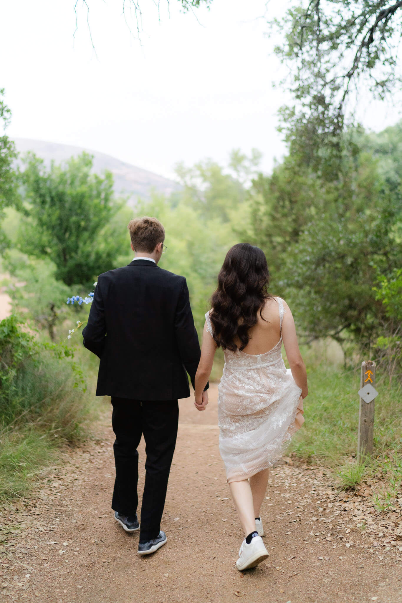 Blue hour light illuminating couple on Enchanted Rock trail