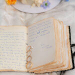Close-up of wedding rings resting on vow book at Enchanted Rock elopement