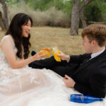 bride and groom sharing whataburger during their creative and relaxing enchanted rock elopement