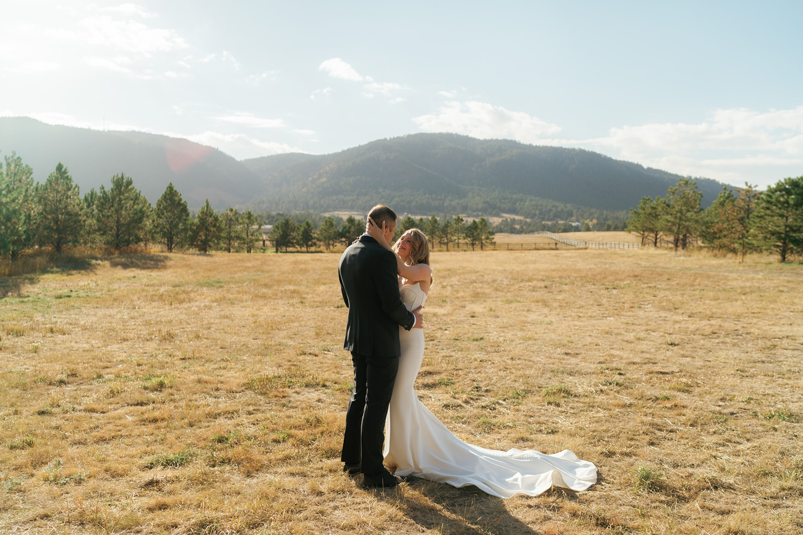 Newlyweds share a dance in a pasture while holding each other while Eloping in Montana