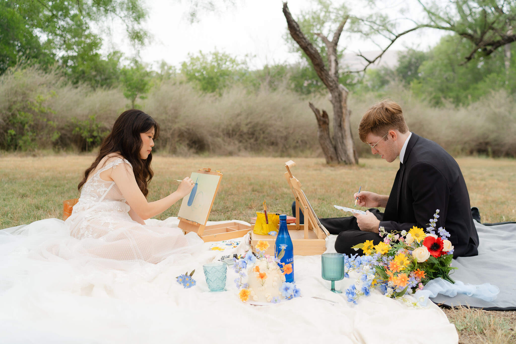 Couple shares a picnic and paints after their elopement