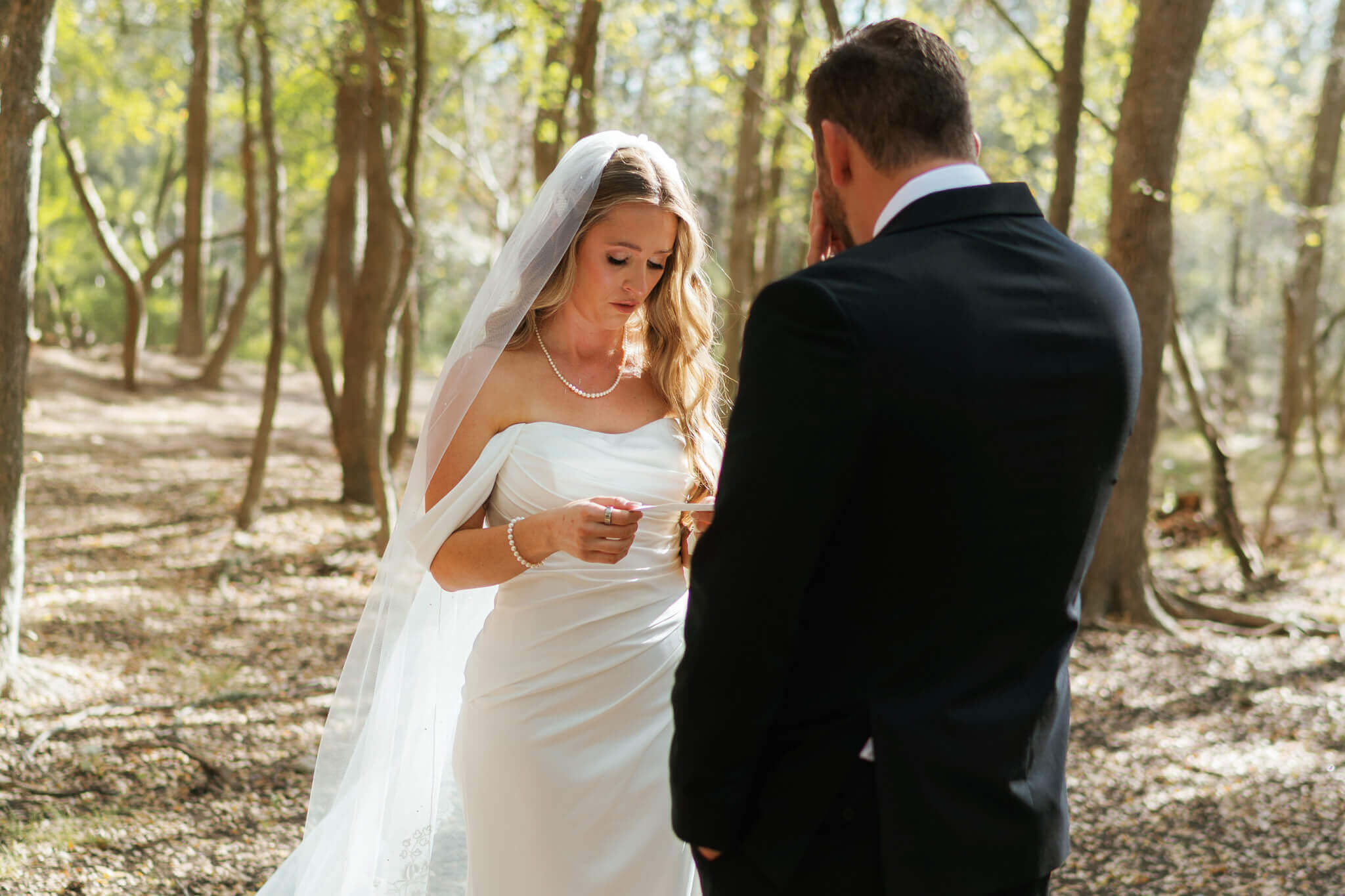 Couple sharing their vows in a park during their Austin Elopement