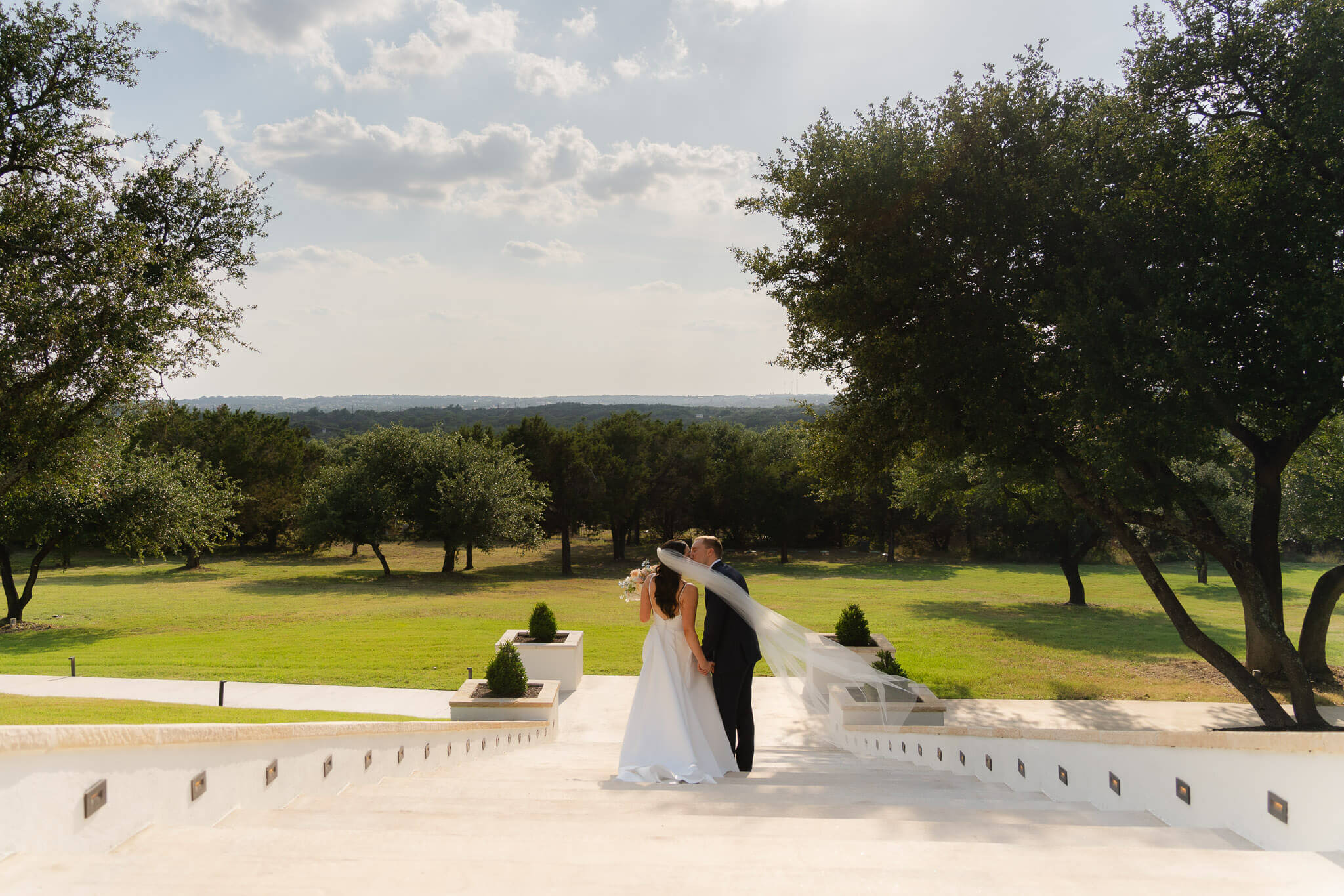 Couple walking down the Arlo steps with incredible views