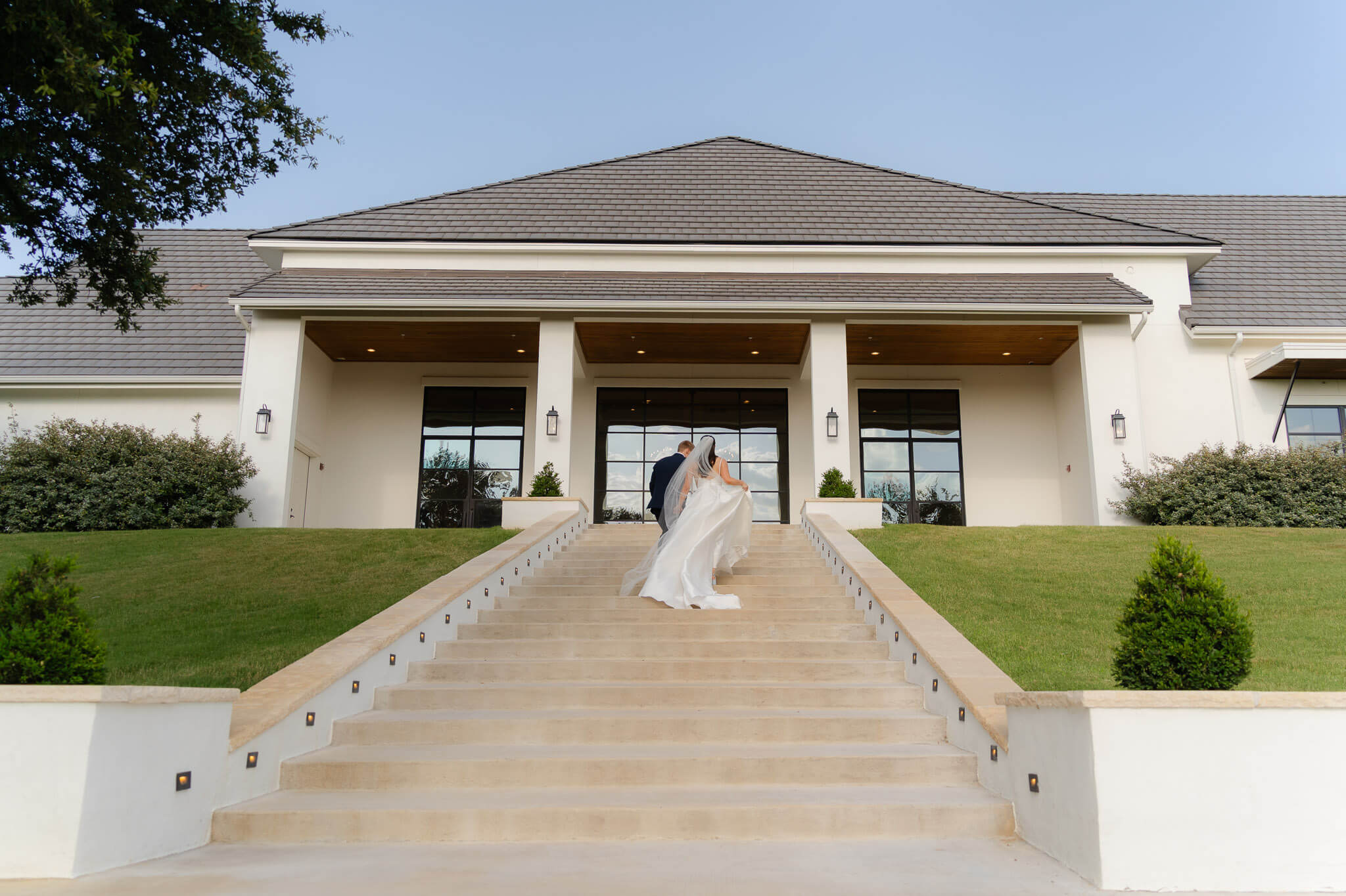 Couple walking up the stairs of the Arlo, a modern Wedding Austin venues