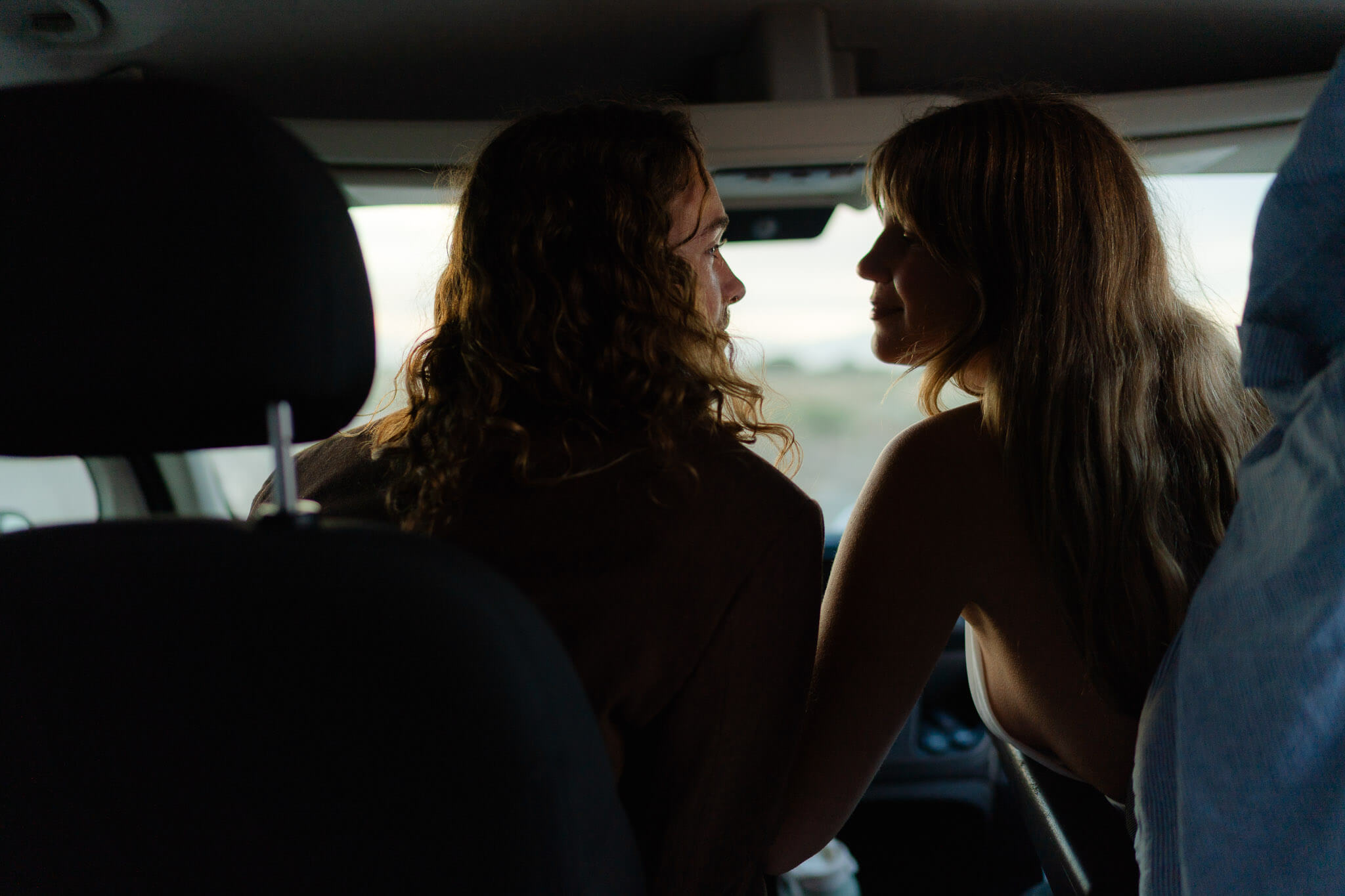 Offroad adventure: couple in van driving to a secluded ceremony site near Dead Horse Point