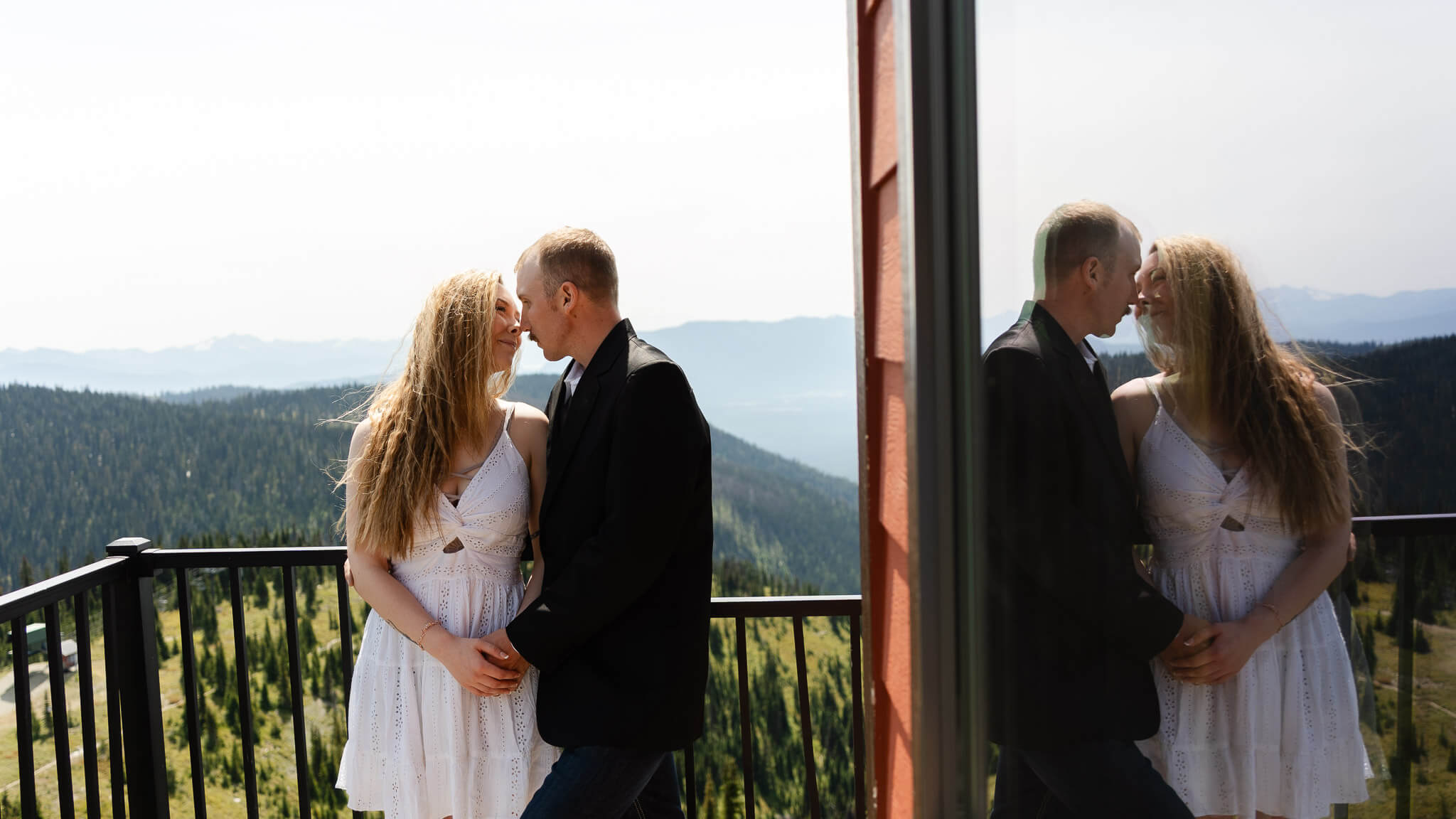 Couple at a viewpoint overlooking Montana mountains
