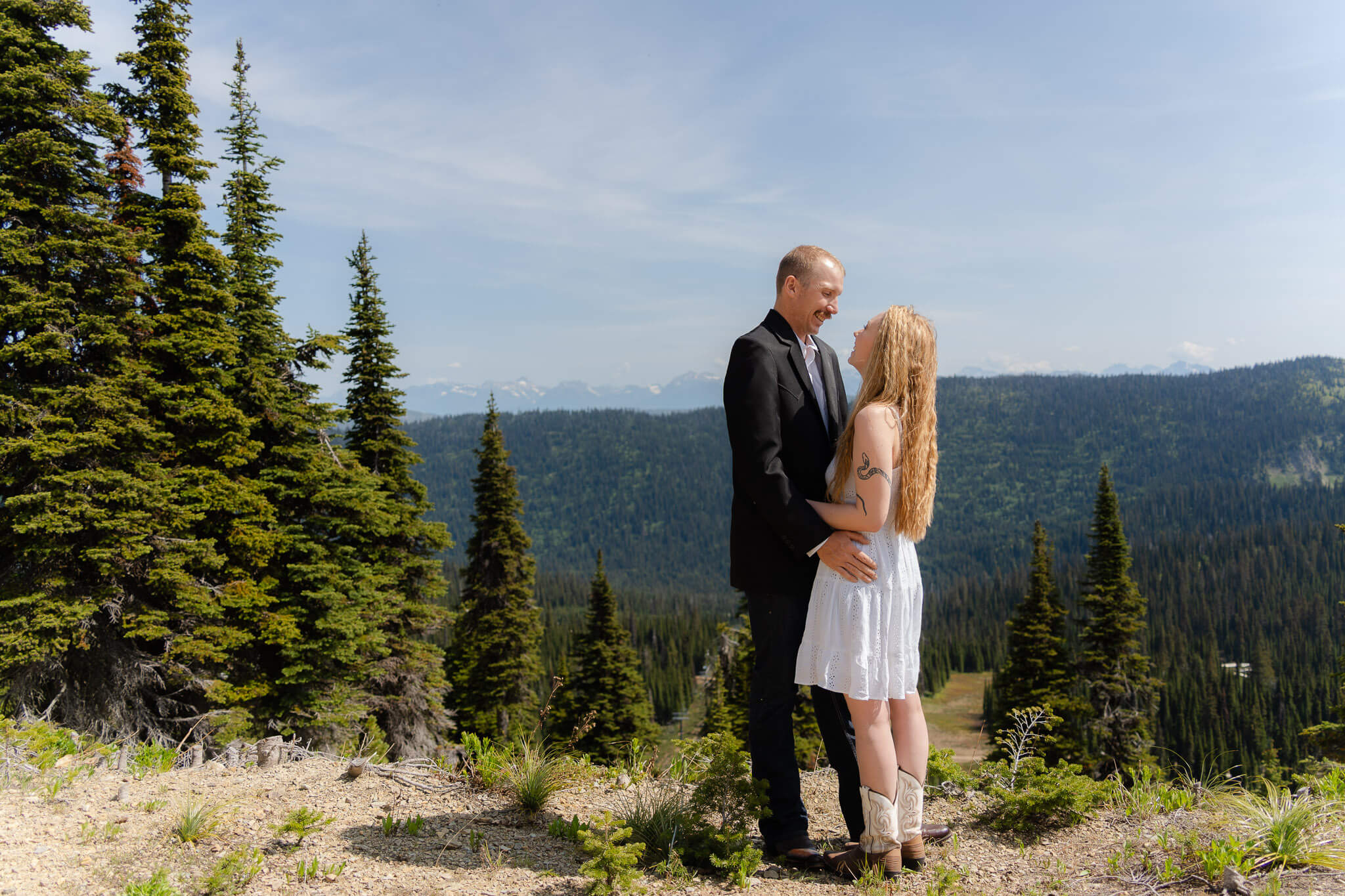 Couple overlooking rolling mountains