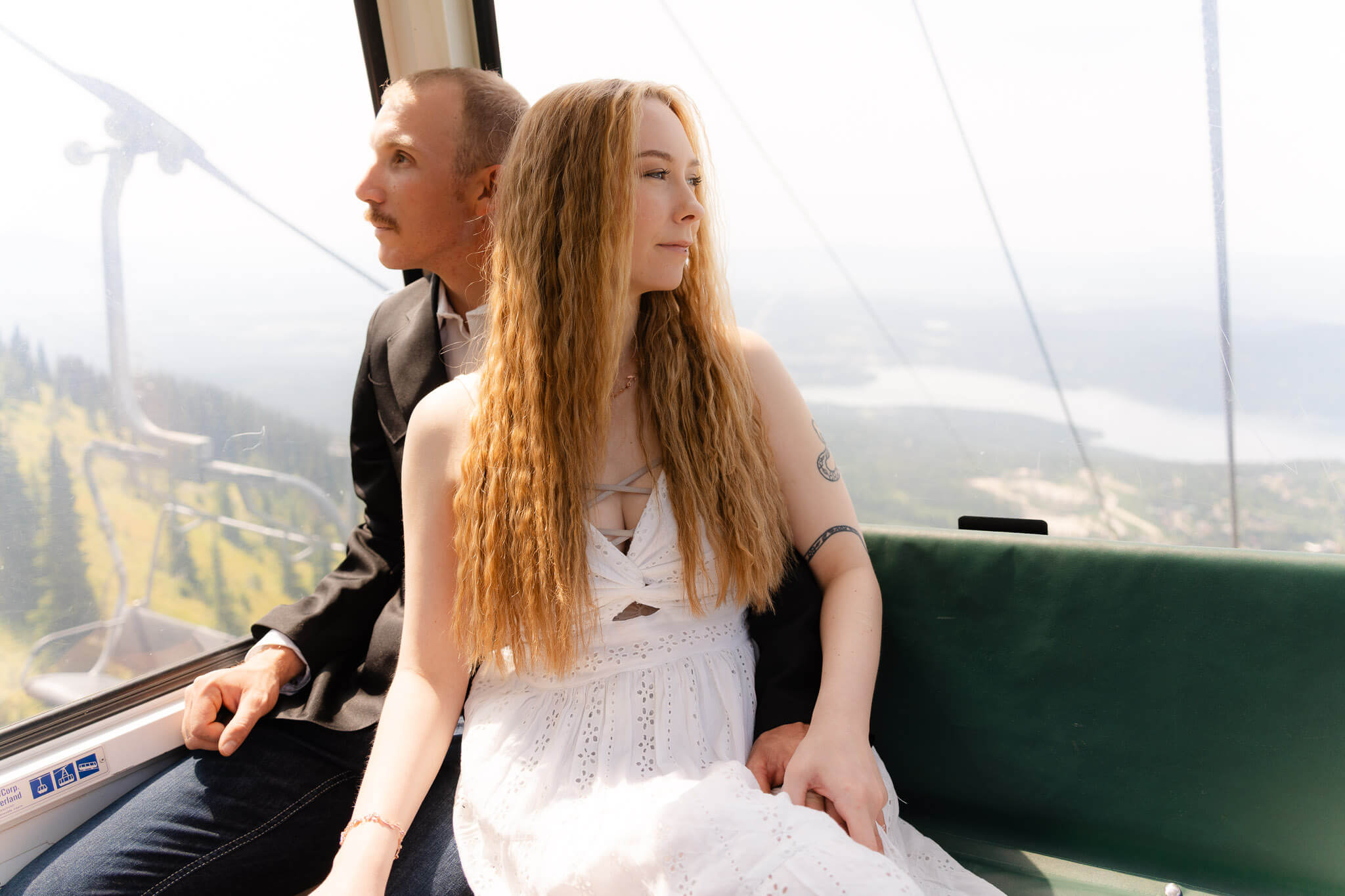 Couple riding gondola up Big Mountain in Montana