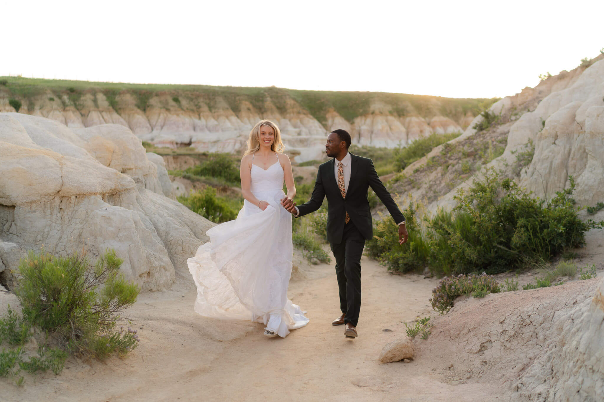 Couple running through paint mines