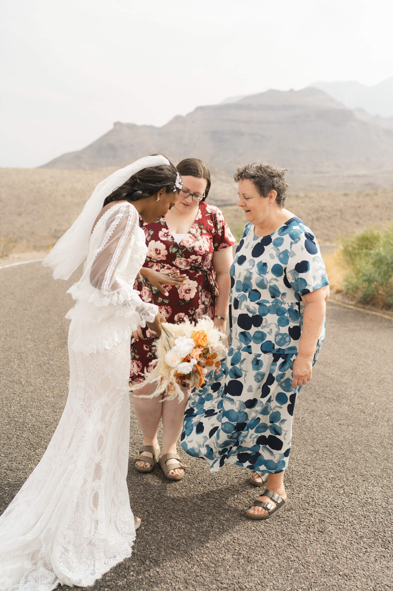 bride shows off her rings during their elopement