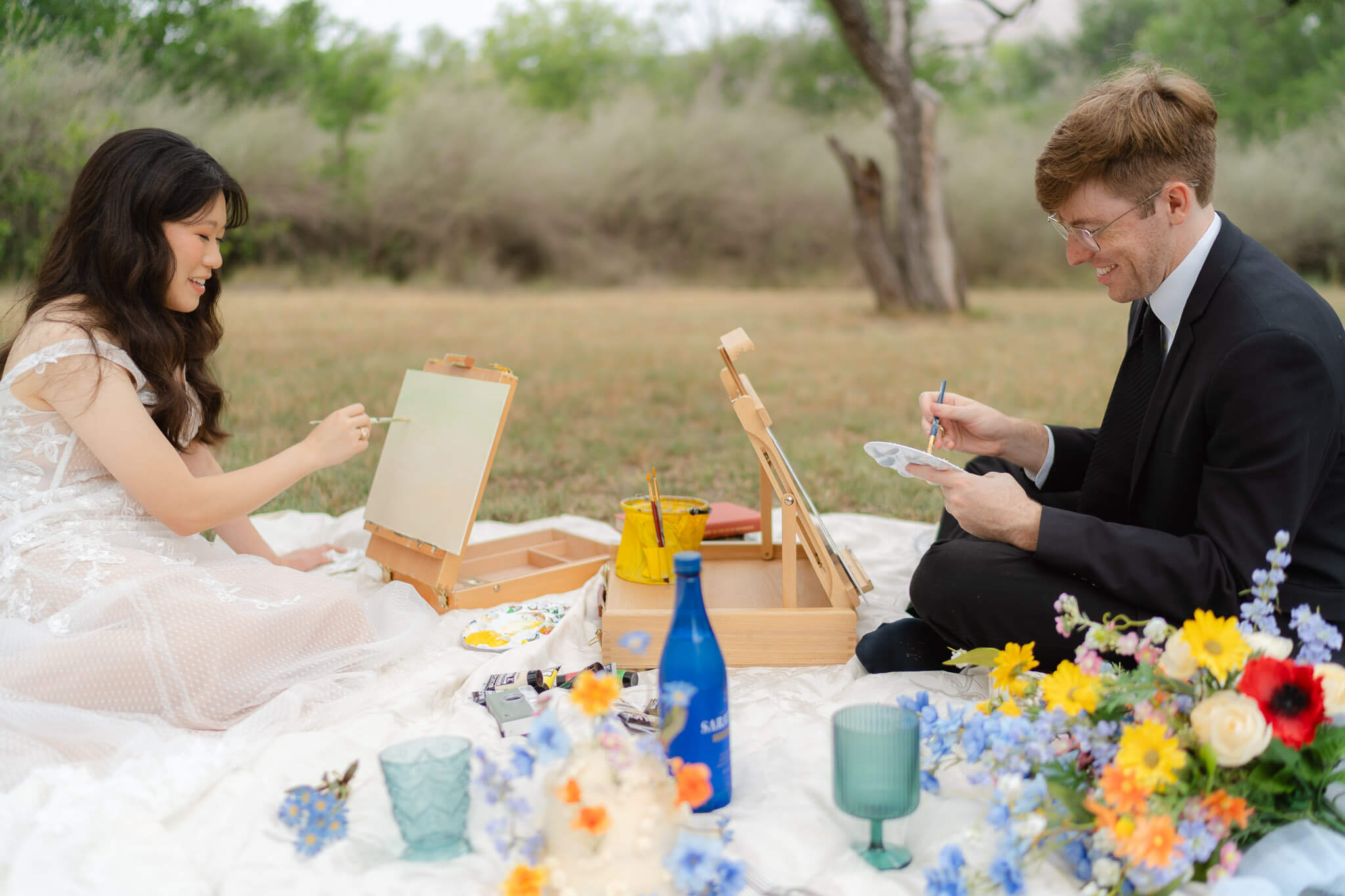 couple shares a painting picnic together as their elopement celebration