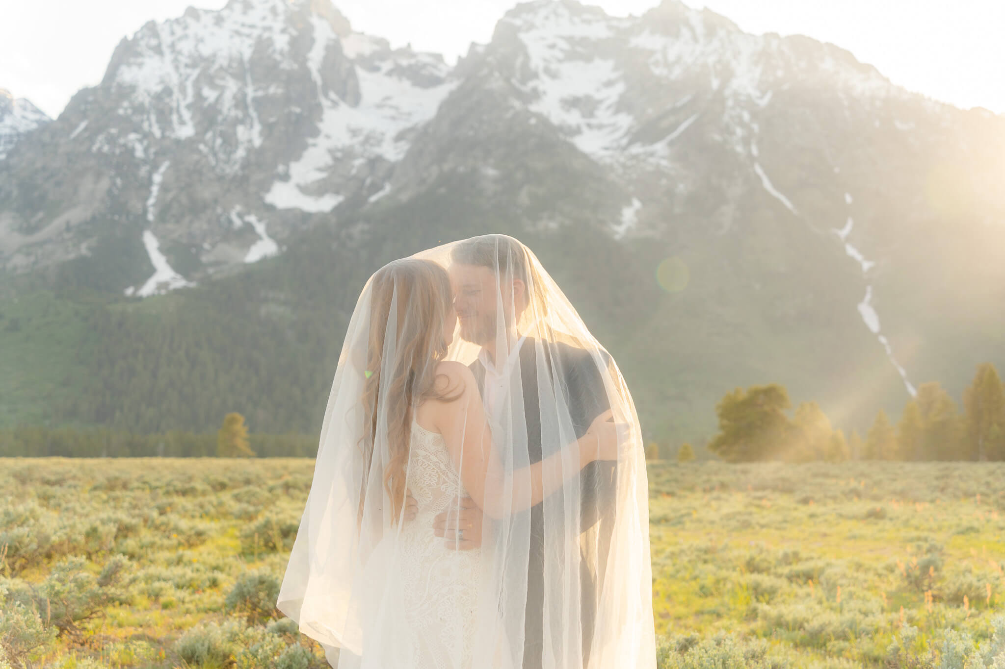 couple enjoys the sunset after grand teton national park wedding