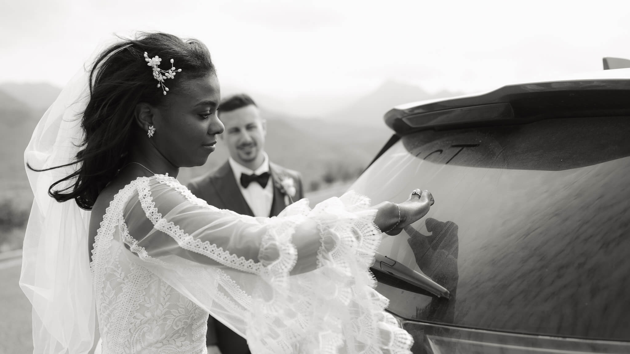 Couple writes just married on their dusty back glass after their Great Sand Dunes National Park Elopement
