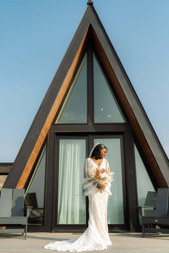 bride standing outside of her rental before she leaves to elope in texas