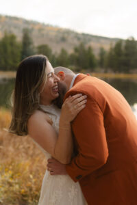 bride and groom laughing together after their Colorado elopement