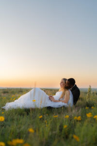 bride and groom watching the sunset since their elopement timeline allowed for extra time