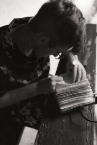 groom writing his vows on a quiet elopement morning