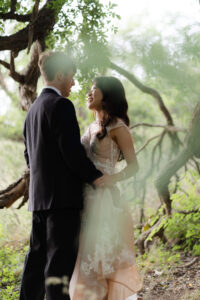 bride and groom sharing their first dance under a tree on their full day elopement
