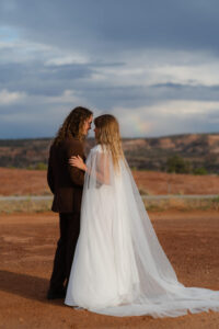 couple enjoying a rainbow during their two day elopement