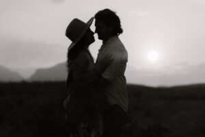 couple standing against the rising sun in Big Bend